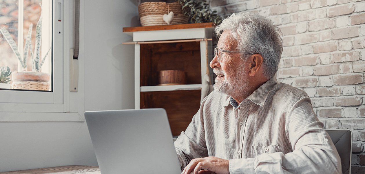 senior man works on laptop at table 2026 01 08 07 10 09 utc