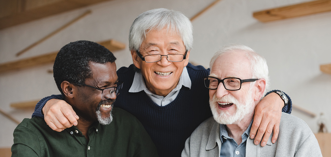 group of multiethnic senior friends embracing in b 2026 03 12 23 56 10 utc