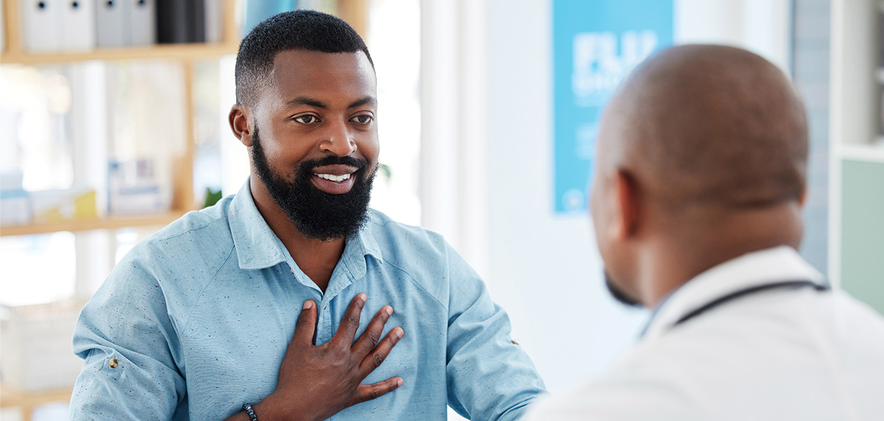 man talking with doctor at clinic office 2026 03 25 06 41 21 utc
