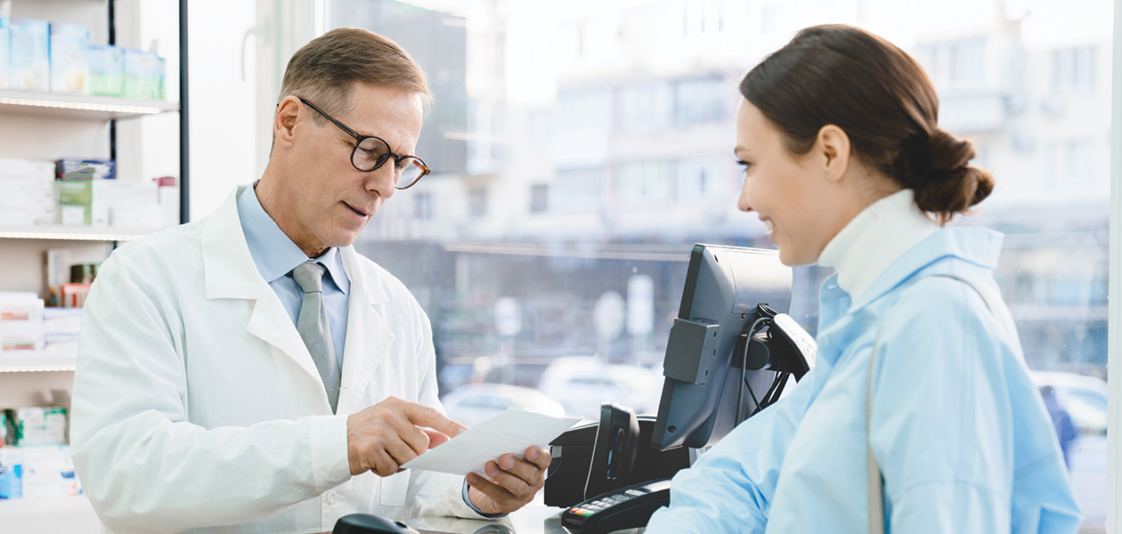 pharmacist looking at medical prescription selling 2022 01 12 22 33 04 utc