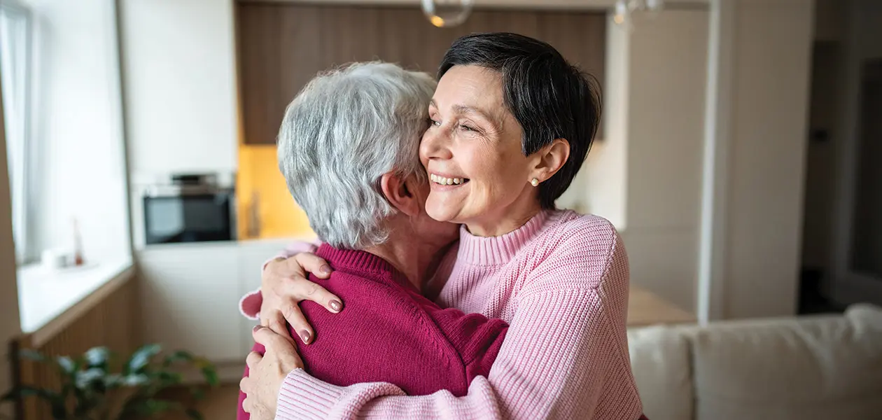 affectionate women embracing in a bright modern h 2026 03 25 23 33 46 utc