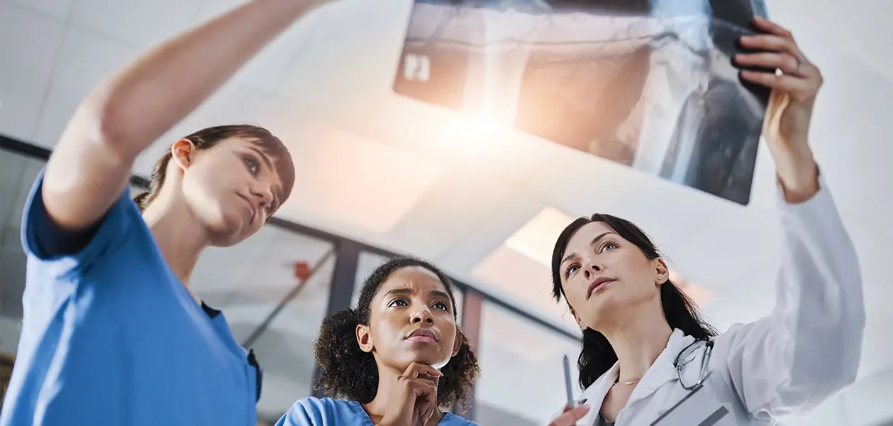 shot of a group of doctors discussing the results 2026 01 09 11 15 00 utc