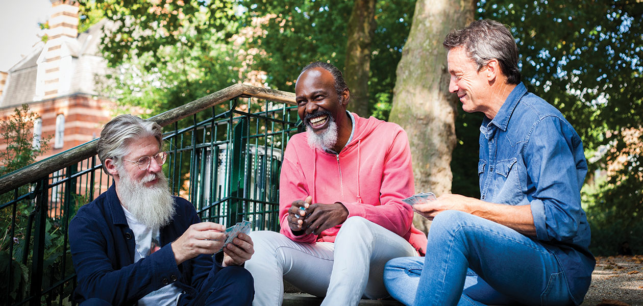 three men play cards in the park 2026 03 25 02 53 24 utc